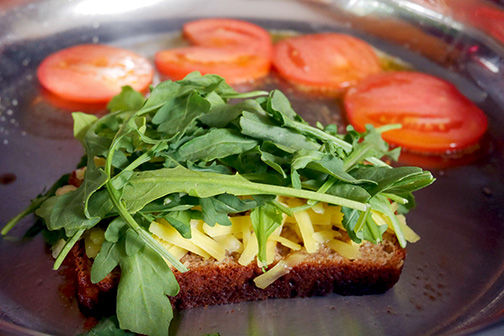 Frying the sandwich bottom and tomatoes