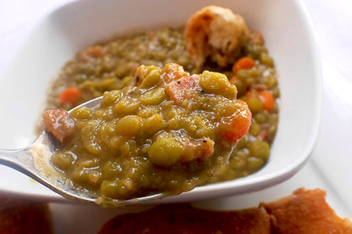 A spoonful of split pea with bacon soup